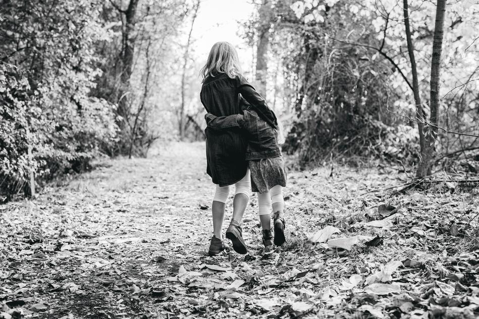 happy siblings in the park in black and white background