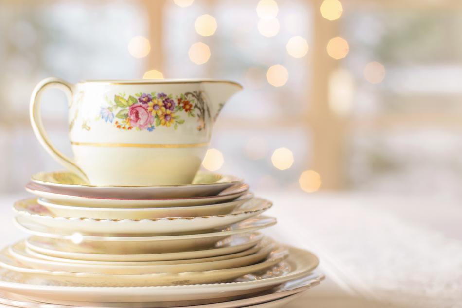 Beautiful and colorful, floral patterned pitcher on the dishes of China, on the table