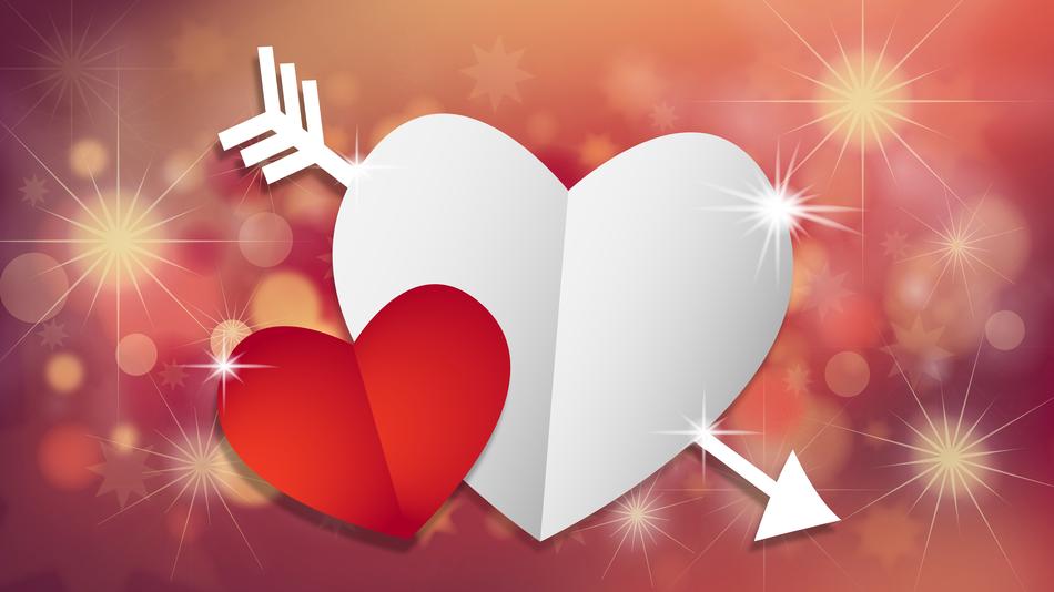 paper red and white hearts on shimmering background