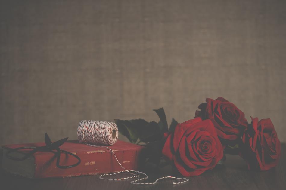 red roses and a gift in the dark