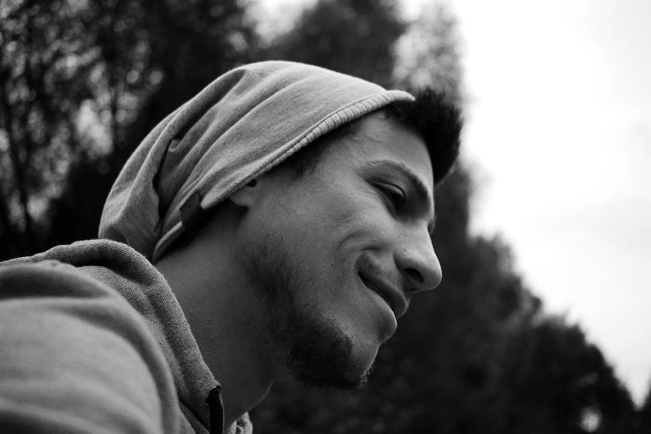 young man in profile in nature in black and white background