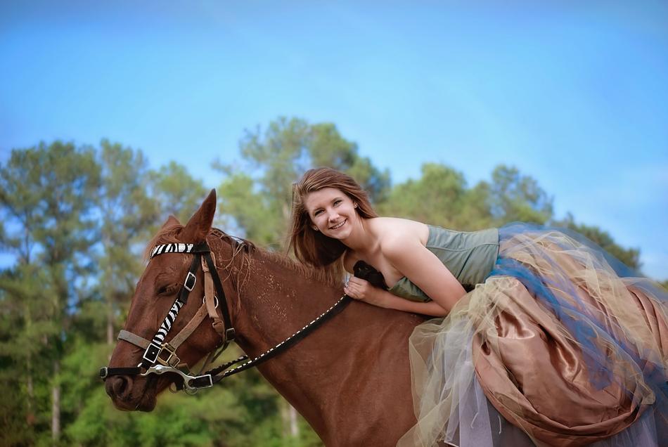 photo of happy Girl Horse Riding