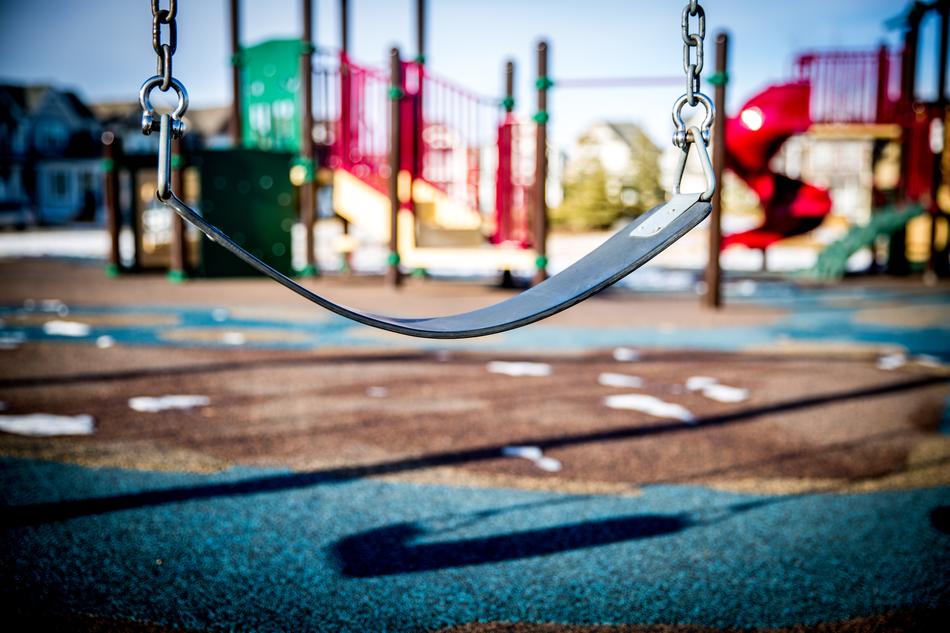 swing on the playground in a blurred background