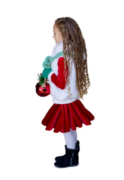 Girl with the curly hair, in the colorful Christmas clothing, at white background
