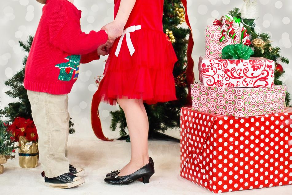 mom with child near Christmas gifts