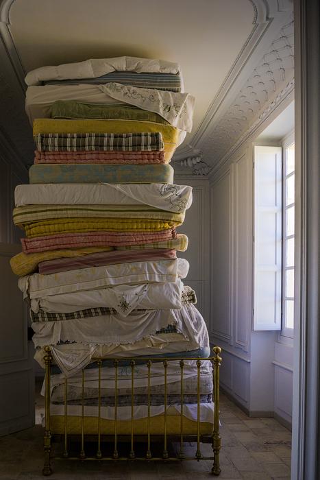 Colorful mattresses near the window with light