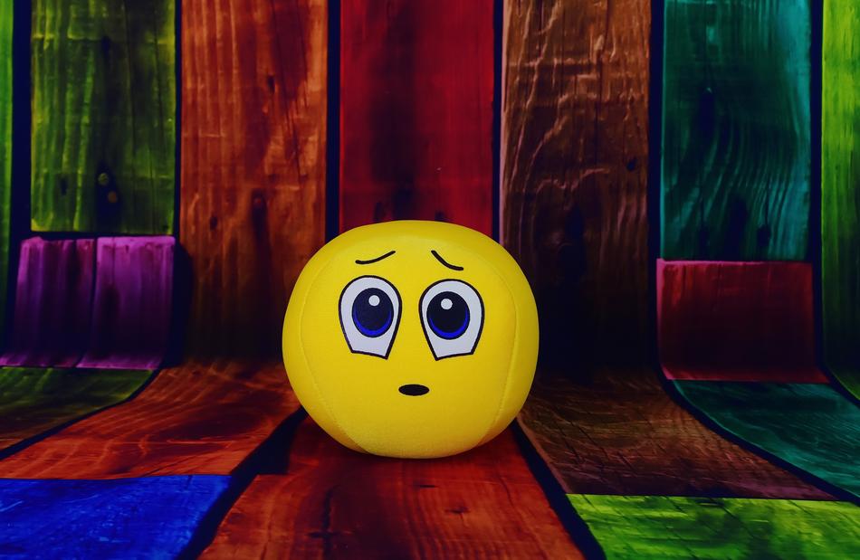 sad emoticon on colorful background