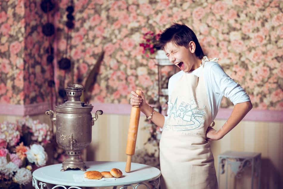 chef with a rolling pin near the samovar