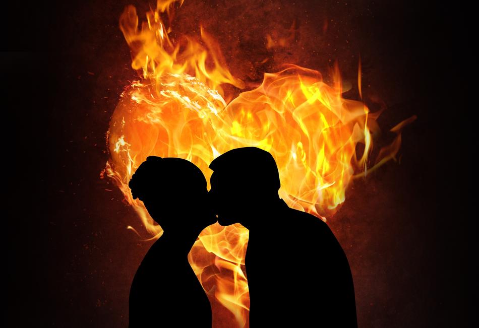 Silhouette of the kissing couple, at background with colorful fire heart, clipart