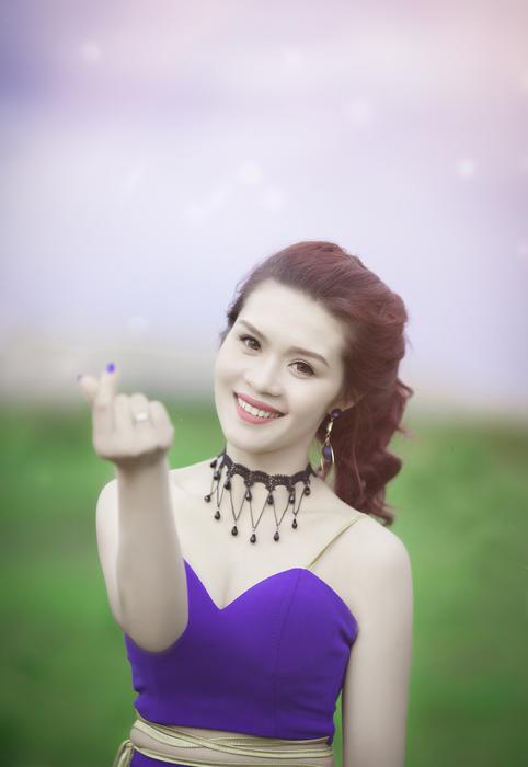 beautiful girl in a blue dress in nature in a blurry background