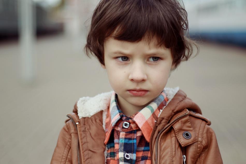 Portrait Of A Boy Frowning