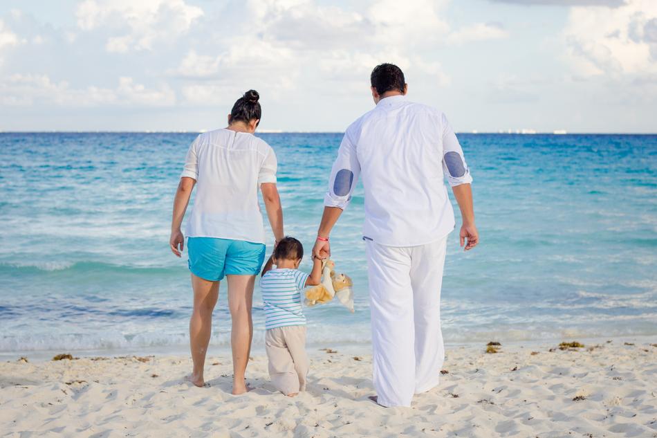 family on the beach near the sea
