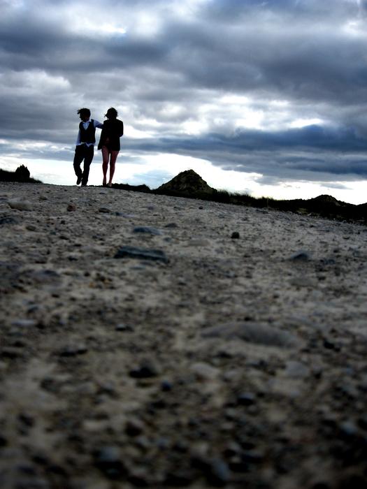 couple in love on a walk under stormy clouds