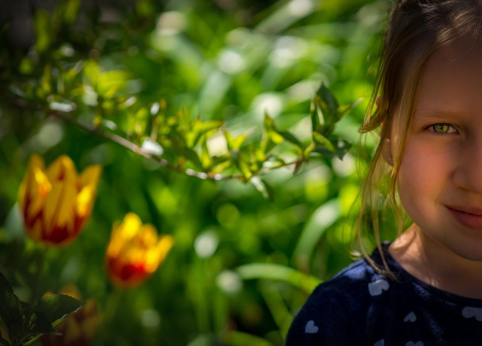 Portrait of Child Girl and iris flowers