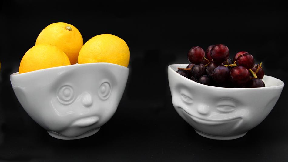 Lemons and Grapes in white wases with faces