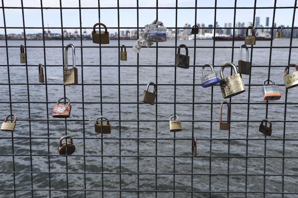 locks of love on a lattice on the runway of the sea in North Vancouver