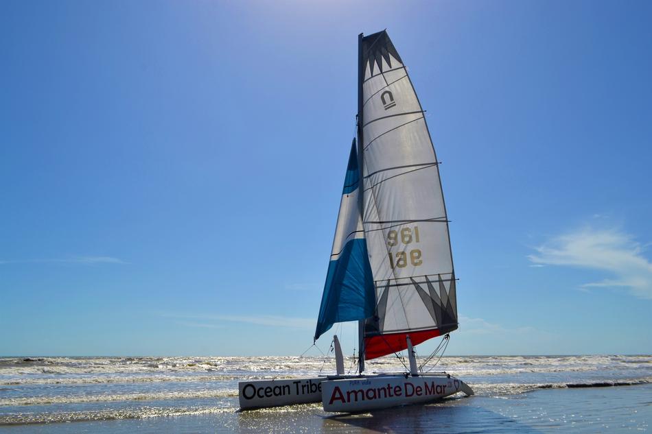 sailboat in the ocean against the blue sky