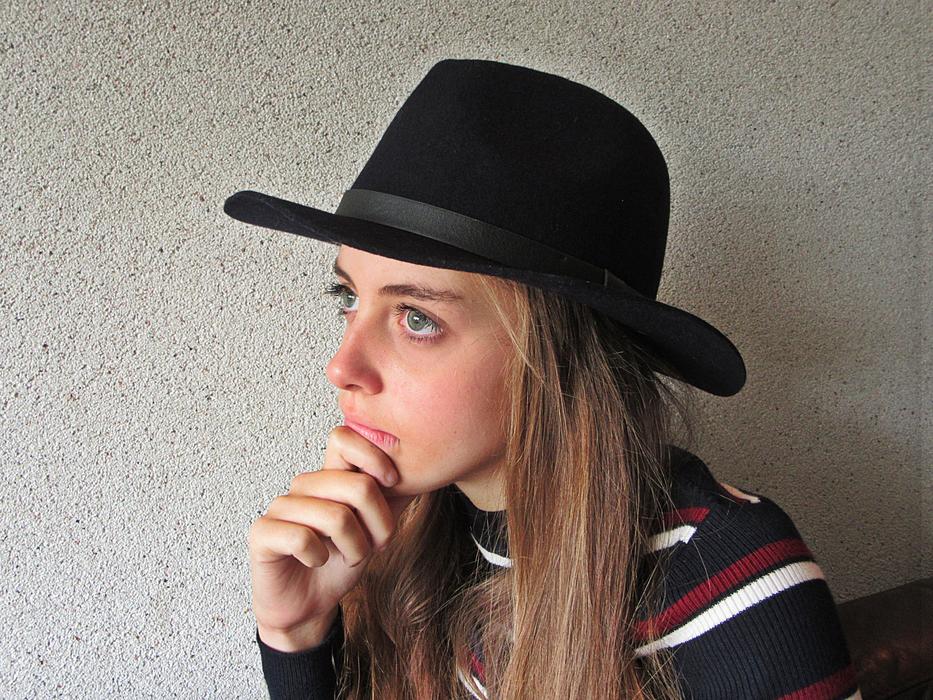 pensive blonde in black hat