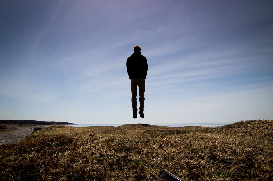 Man Jumping on coastline