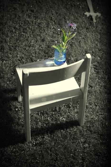 flower on a chair in a funeral place
