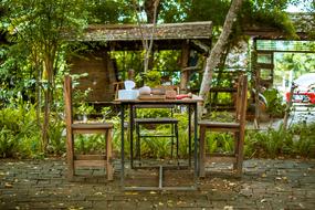 wooden chairs and table outdoors