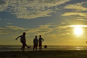 Football playing Children on Beach