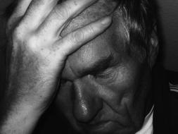 black and white, depressed man with closed eyes