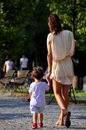 Holding Hands Mom And Daughter walking