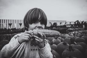 Child eating corn