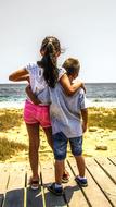 Boy And Girl on pier