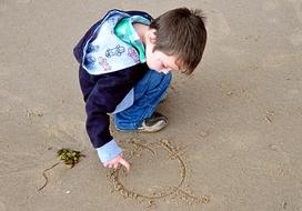 Little Boy Child play on Sand