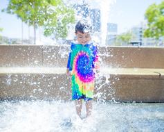 kid in Water Fountain