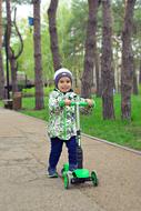 Boy with Scooter in Park