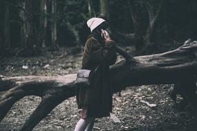 girl near the Tree Branch in forest