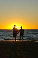 Sunset Couple Holding Hands