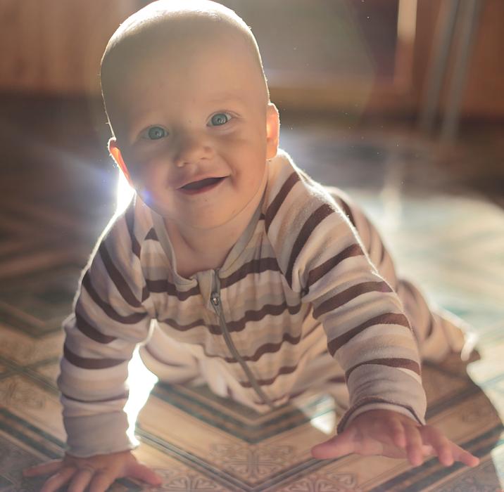 baby in striped romper