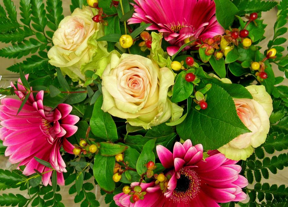 Bouquet of the colorful and beautiful flowers with green leaves