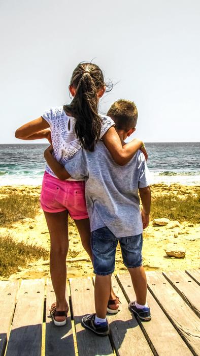 Boy And Girl on pier