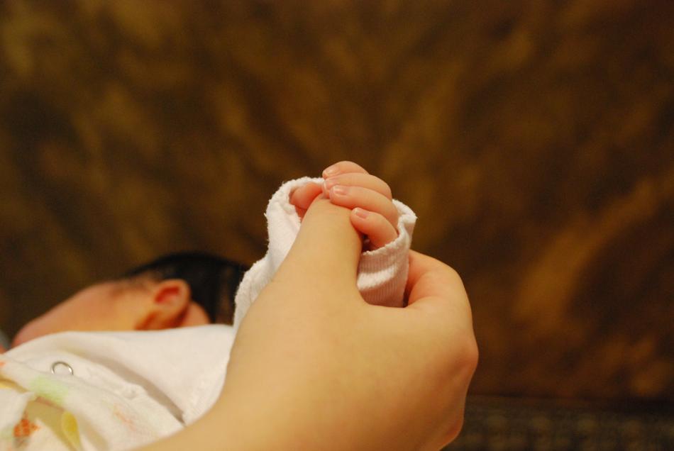 Baby Hands With Mom And