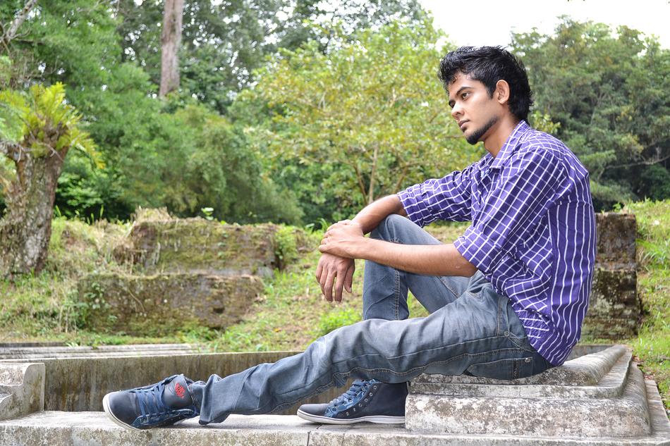 sad guy in a plaid shirt in Sri Lanka