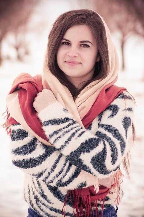 beautiful Girl in sweater and scarf outdoor Portrait