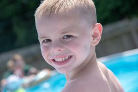 smiling child by the pool