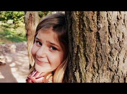 Young girl with tree