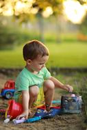 child playing in the sandbox