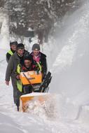 Workers clearing snow