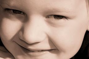 closeup photo of smiling boy eyes