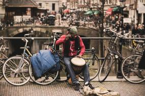 man with a drum by the bikes