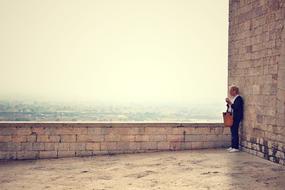 man standing against the wall