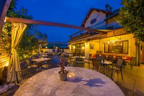 bar tables illuminated by lanterns