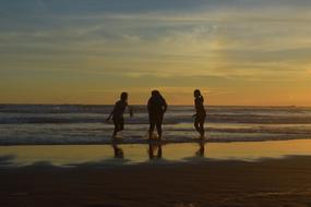 Friendship Silhouette on beach at Sunset